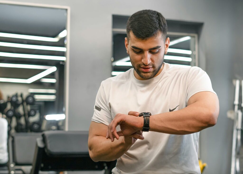 Person using advanced tech in a fitness environment»